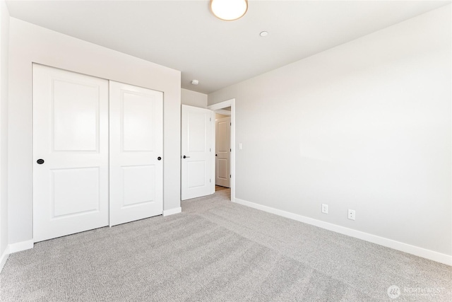 13906 178th Street Ct E Unit 62, Puyallup, WA 98374 - unfurnished bedroom with carpet flooring, baseboards, and a closet