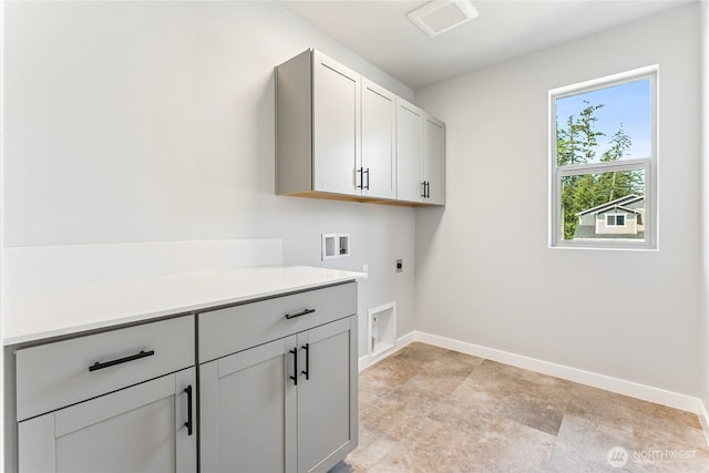13906 178th Street Ct E Unit 62, Puyallup, WA 98374 - laundry area featuring cabinet space, hookup for a washing machine, electric dryer hookup, and baseboards