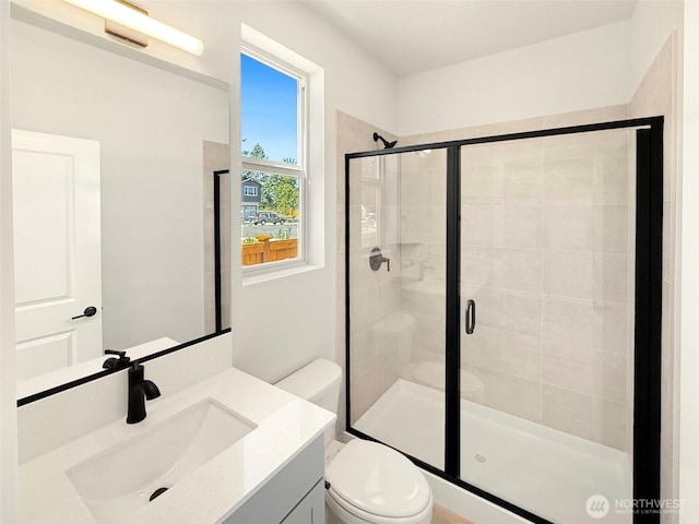 13906 178th Street Ct E Unit 62, Puyallup, WA 98374 - bathroom with a shower stall, toilet, and vanity