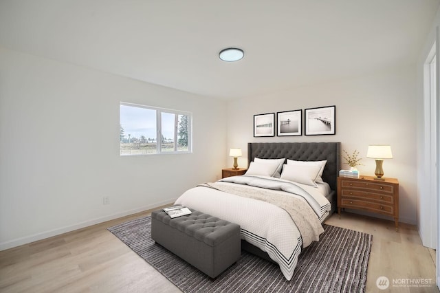 7110 146th St SW Unit 35, Lakewood, WA 98439 - bedroom featuring light wood finished floors and baseboards