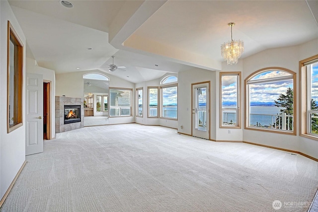 1433 Crestview Dr, Camano Island, WA 98282 - unfurnished living room with lofted ceiling, light colored carpet, a chandelier, baseboards, and a tiled fireplace