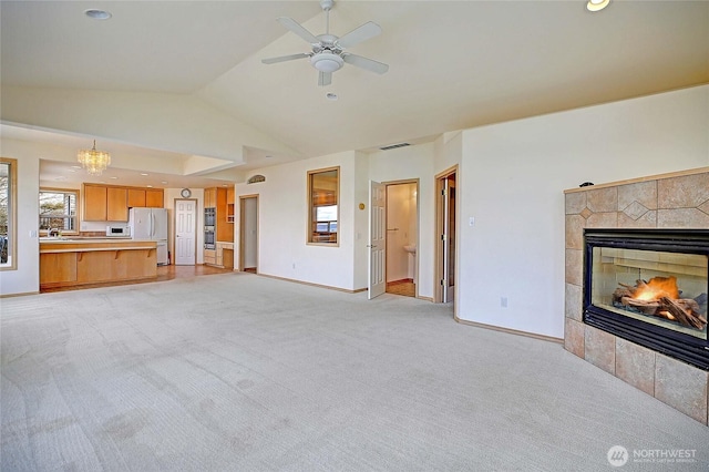 1433 Crestview Dr, Camano Island, WA 98282 - unfurnished living room featuring lofted ceiling, light colored carpet, a fireplace, baseboards, and recessed lighting