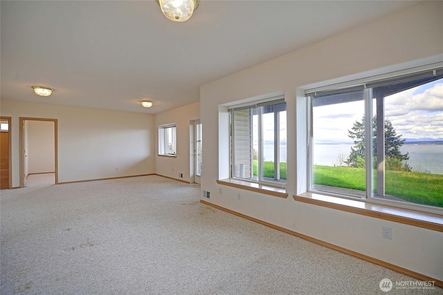 1433 Crestview Dr, Camano Island, WA 98282 - spare room featuring baseboards and light carpet