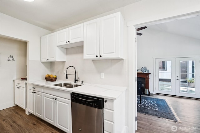 817 SW 158th St, Burien, WA 98166 - kitchen featuring stainless steel dishwasher, dark wood-style flooring, white cabinetry, light stone counters, and lofted ceiling