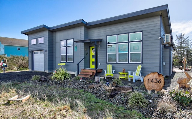 1436 Sand Pebble Ave SW, Ocean Shores, WA 98569 - contemporary house featuring a garage
