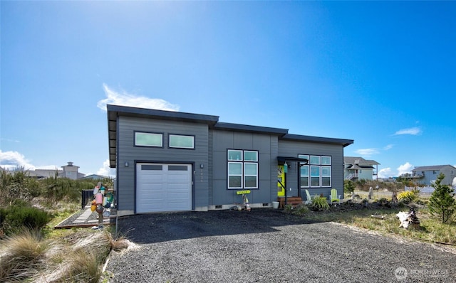 1436 Sand Pebble Ave SW, Ocean Shores, WA 98569 - contemporary home featuring gravel driveway, an attached garage, and crawl space