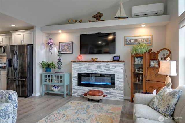 1436 Sand Pebble Ave SW, Ocean Shores, WA 98569 - living area featuring recessed lighting, light wood-style flooring, a wall mounted air conditioner, and vaulted ceiling