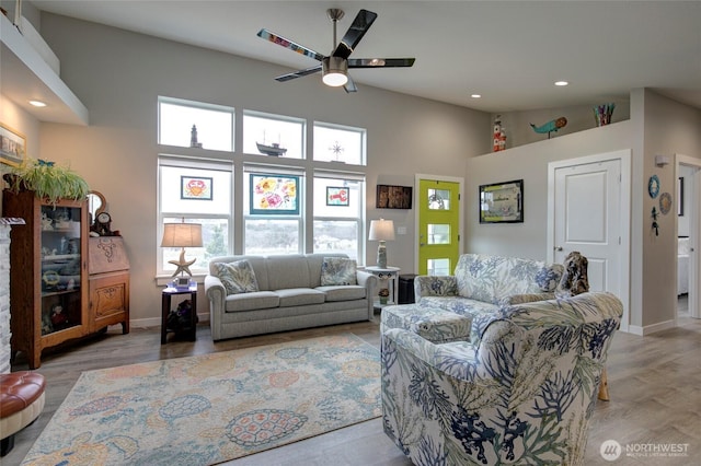 1436 Sand Pebble Ave SW, Ocean Shores, WA 98569 - living room featuring wood finished floors, a ceiling fan, baseboards, recessed lighting, and vaulted ceiling