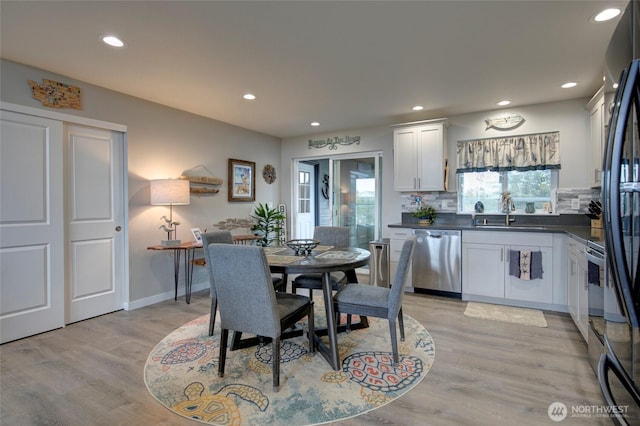 1436 Sand Pebble Ave SW, Ocean Shores, WA 98569 - dining room with recessed lighting, light wood-type flooring, and baseboards