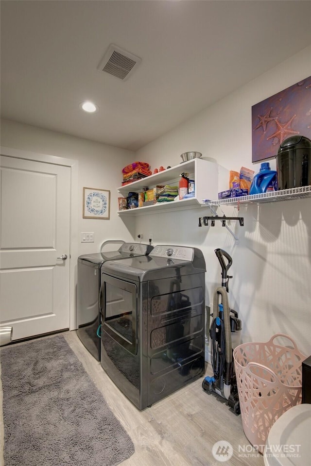 1436 Sand Pebble Ave SW, Ocean Shores, WA 98569 - washroom with visible vents, independent washer and dryer, laundry area, and wood finished floors