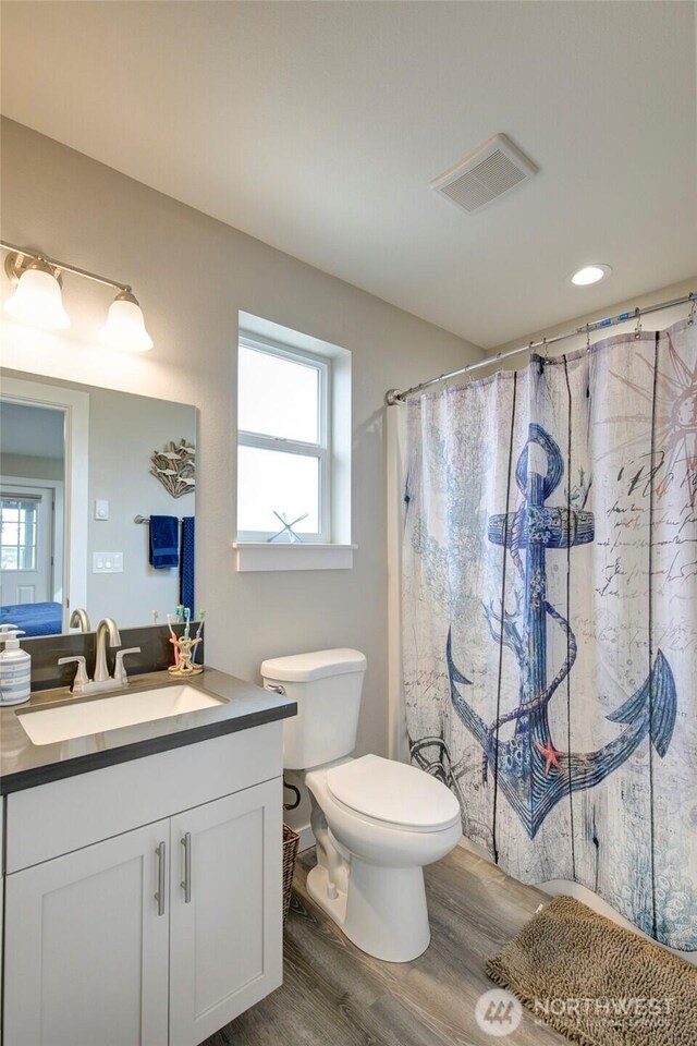 1436 Sand Pebble Ave SW, Ocean Shores, WA 98569 - full bath featuring visible vents, plenty of natural light, vanity, and toilet
