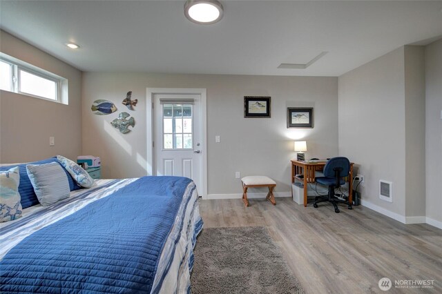 1436 Sand Pebble Ave SW, Ocean Shores, WA 98569 - bedroom with visible vents, multiple windows, baseboards, and light wood-style flooring