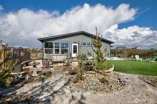 1436 Sand Pebble Ave SW, Ocean Shores, WA 98569 - rear view of property featuring a patio, a yard, and fence