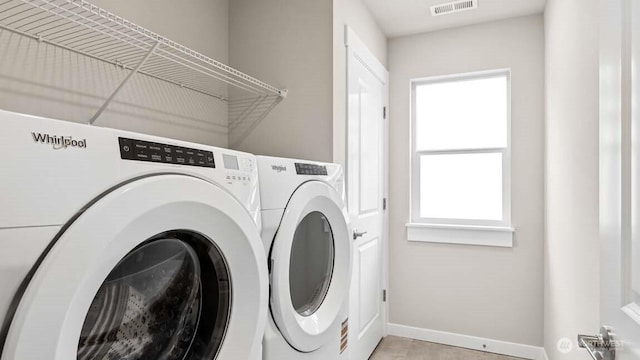 10591 135th Ave NE Unit 24, Kirkland, WA 98033 - laundry room with washer and clothes dryer and baseboards