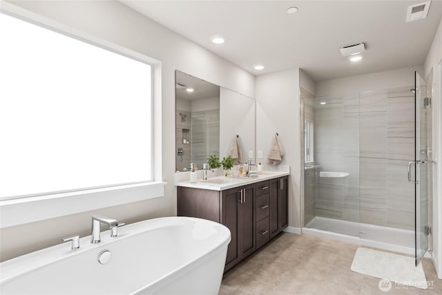 10591 135th Ave NE Unit 24, Kirkland, WA 98033 - bathroom with a stall shower, a freestanding bath, double vanity, and recessed lighting