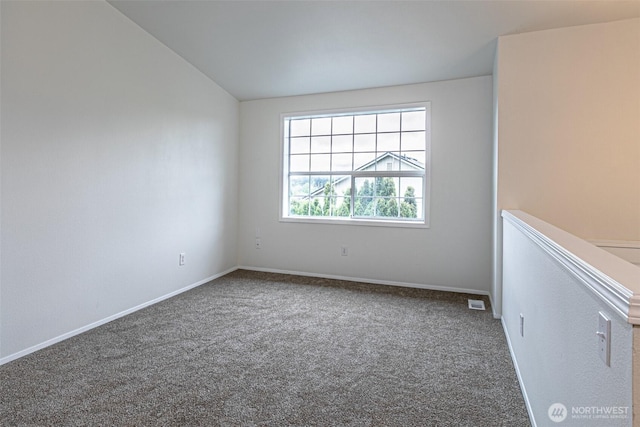 carpeted empty room with baseboards