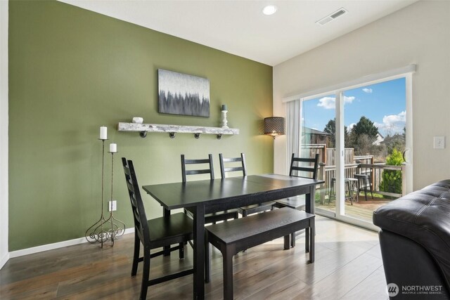 dining room with visible vents, recessed lighting, baseboards, and wood finished floors