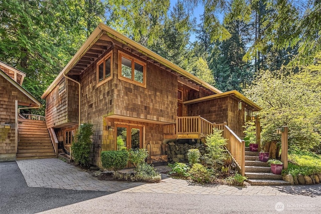 log home featuring stairway