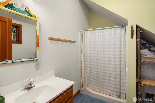bathroom with vanity and curtained shower