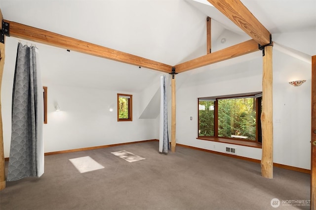 additional living space featuring carpet floors, vaulted ceiling with beams, baseboards, and visible vents