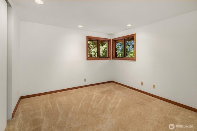 carpeted spare room with baseboards and recessed lighting