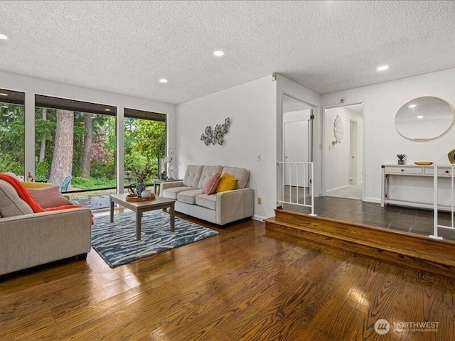 3616 SW 325th St, Federal Way, WA 98023 - living area featuring a textured ceiling, wood finished floors, recessed lighting, and baseboards