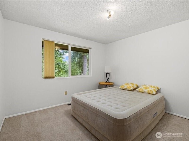 3616 SW 325th St, Federal Way, WA 98023 - carpeted bedroom featuring baseboards and a textured ceiling