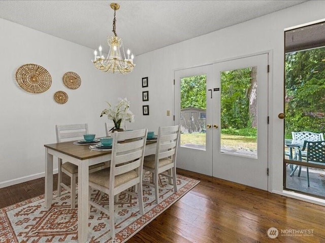 3616 SW 325th St, Federal Way, WA 98023 - dining room featuring healthy amount of natural light, a chandelier, wood finished floors, and french doors