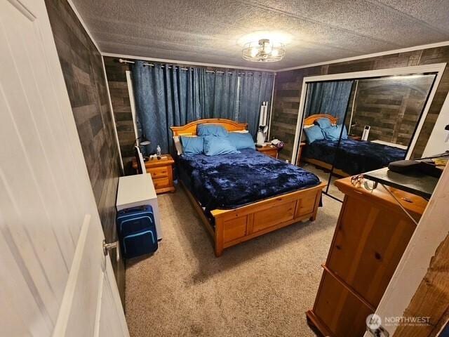 6505 Fawn Ln Unit 4, Long Beach, WA 98631 - bedroom featuring light carpet, crown molding, and a textured ceiling