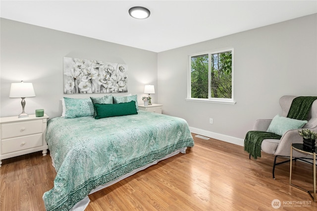 17406 Redhawk Dr, Arlington, WA 98223 - bedroom with baseboards and wood finished floors