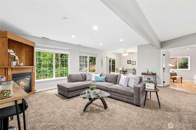 17406 Redhawk Dr, Arlington, WA 98223 - living room featuring a glass covered fireplace, recessed lighting, baseboards, wood finished floors, and a ceiling fan