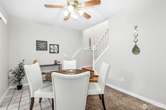 17406 Redhawk Dr, Arlington, WA 98223 - dining room with baseboards, a ceiling fan, and stairs