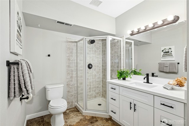 17406 Redhawk Dr, Arlington, WA 98223 - bathroom with toilet, a stall shower, vanity, and baseboards
