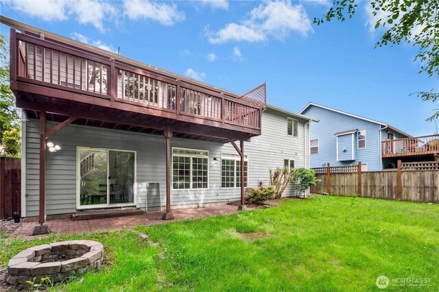17406 Redhawk Dr, Arlington, WA 98223 - rear view of house featuring an outdoor fire pit and a deck