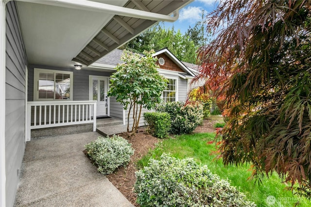 17406 Redhawk Dr, Arlington, WA 98223 - property entrance featuring a porch and a shingled roof