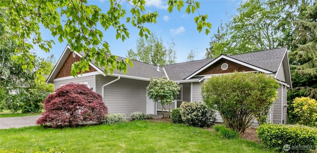 17406 Redhawk Dr, Arlington, WA 98223 - view of front of home featuring a front yard and a shingled roof