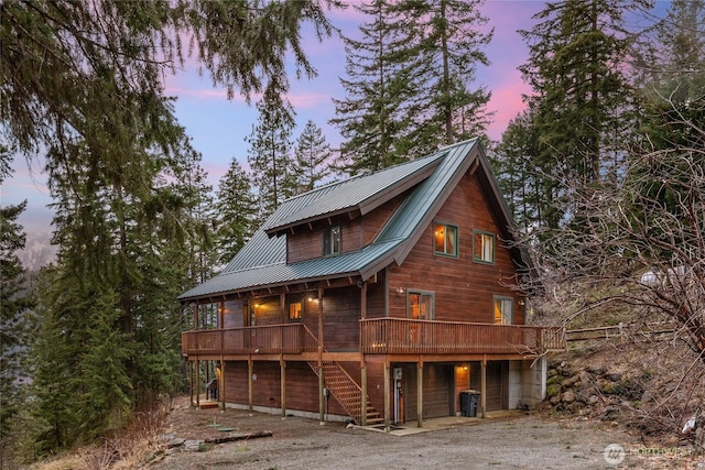 791 Lake Forest Dr, Ronald, WA 98940 - view of front facade with a deck, stairway, driveway, central AC, and metal roof