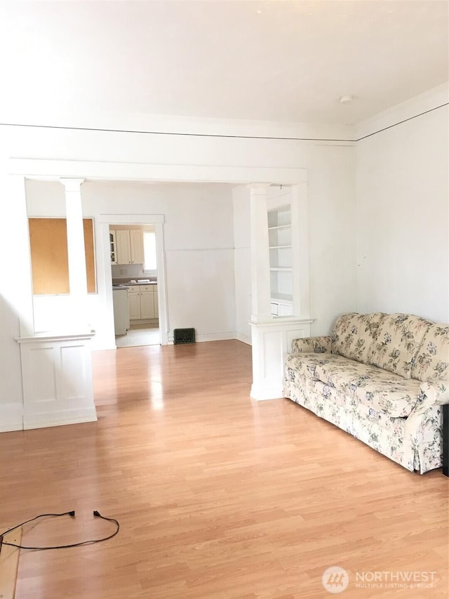 5011 8th Ave NE, Seattle, WA 98105 - unfurnished living room with light wood finished floors