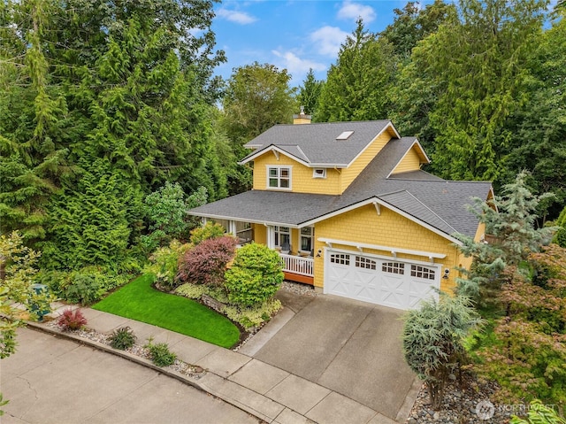 view of front of property with an attached garage, a shingled roof, a porch, a chimney, and driveway