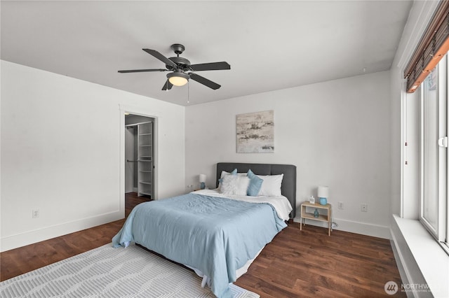 1625 185th Street Ct E, Spanaway, WA 98387 - bedroom featuring wood finished floors, ceiling fan, and a spacious closet