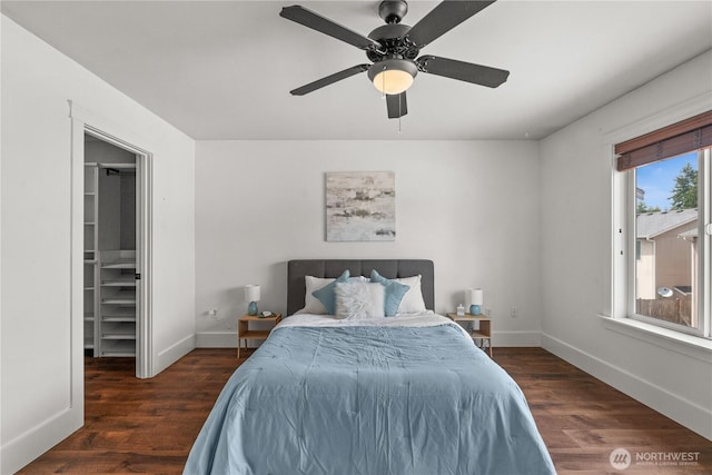 1625 185th Street Ct E, Spanaway, WA 98387 - bedroom featuring wood finished floors, ceiling fan, and a walk in closet