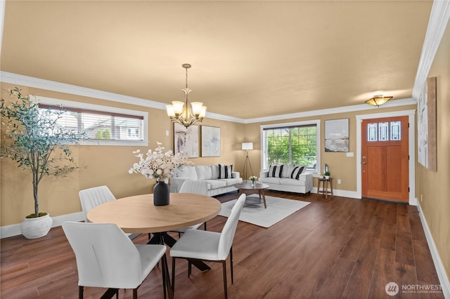 1625 185th Street Ct E, Spanaway, WA 98387 - dining area featuring a chandelier, healthy amount of natural light, crown molding, and dark wood-type flooring