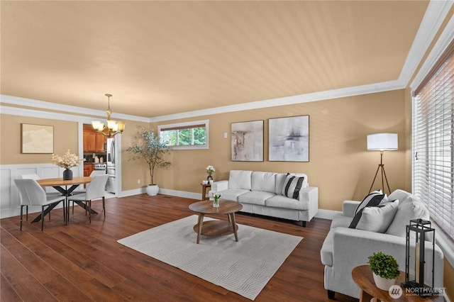 1625 185th Street Ct E, Spanaway, WA 98387 - living area with a chandelier, dark wood-type flooring, and ornamental molding