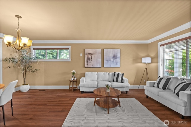 1625 185th Street Ct E, Spanaway, WA 98387 - living room featuring a chandelier, crown molding, and wood finished floors