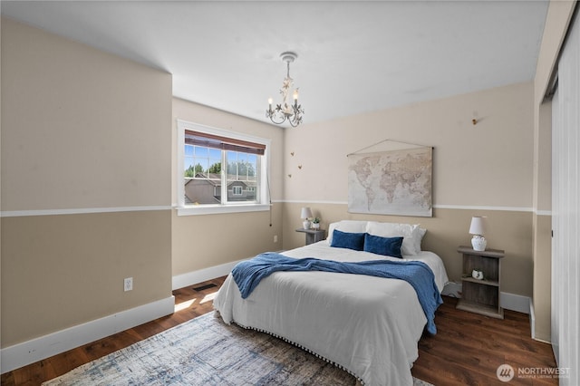 1625 185th Street Ct E, Spanaway, WA 98387 - bedroom featuring a chandelier and wood finished floors