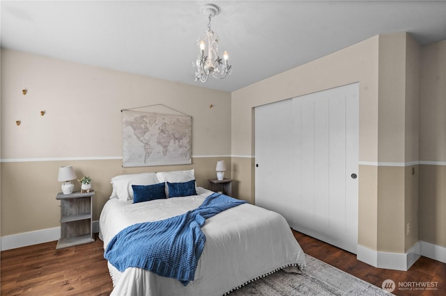 1625 185th Street Ct E, Spanaway, WA 98387 - bedroom featuring a closet, a chandelier, and wood finished floors