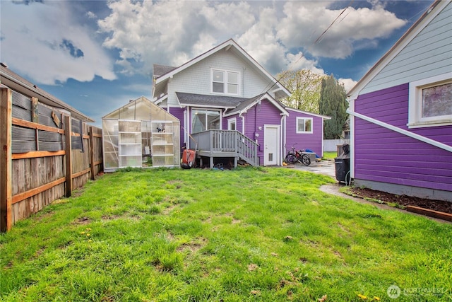 3594 E Mckinley Ave, Tacoma, WA 98404 - back of house with an exterior structure, a yard, fence, and an outbuilding