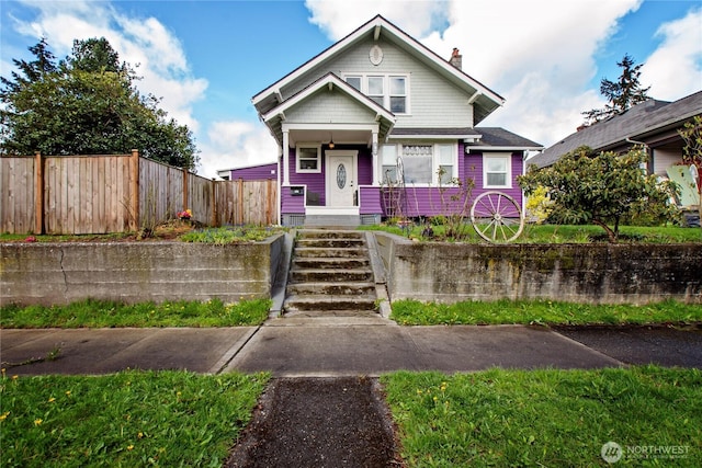 3594 E Mckinley Ave, Tacoma, WA 98404 - bungalow-style house featuring a fenced front yard and a chimney