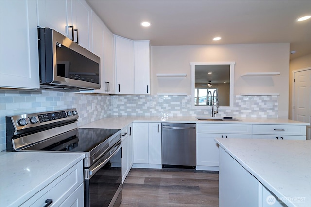 16283 Hwy 97, Ellensburg, WA 98926 - kitchen featuring open shelves, appliances with stainless steel finishes, dark wood-type flooring, white cabinets, and recessed lighting