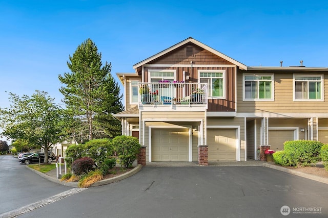 588 241st Ln SE, Sammamish, WA 98074 - view of property with a garage, driveway, and a balcony